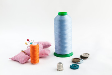 Sewing utensils, scissors, thread, buttons isolated on white bac