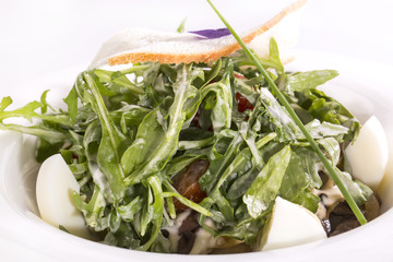 salad greens and egg sauce in a restaurant