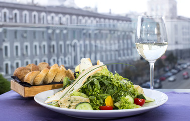 salad with cheese and arugula in a restaurant
