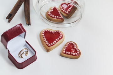 Romantic heart shaped homemade Valentine cookies with wedding ri