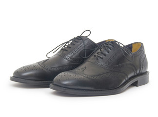 Close-up of mens shoes on white background