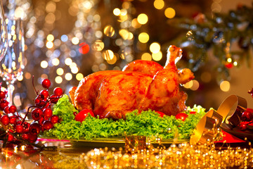 Christmas dinner. Holiday decorated table with roasted turkey