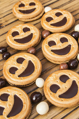 Round smiling chocolate cookies with chocolate balls