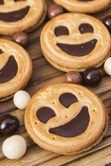 Round smiling chocolate cookies with chocolate balls