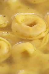 Tortellini diped and cooked in chicken broth.