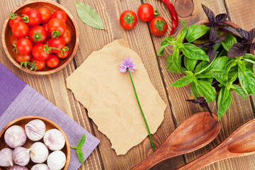 Fresh farmers tomatoes and basil on wood table