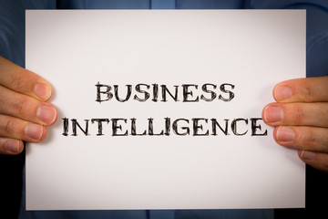 Man with Business Intelligence sign