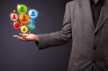 Social network icons in the hand of a businessman