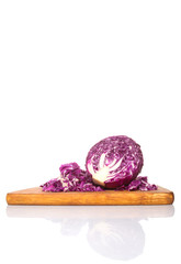 Chopped red cabbage on cutting board over white background