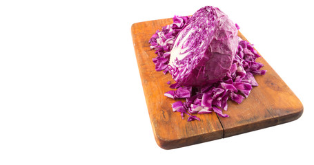 Chopped red cabbage on cutting board over white background