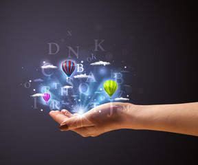 Letters and balloons in the hand of a woman