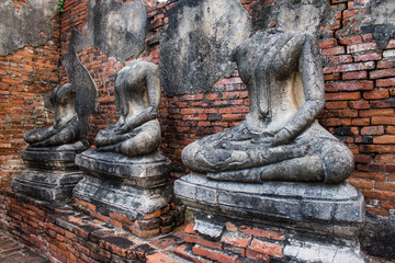 Fototapeta na wymiar Headless damaged buddha in the ancient ayutthaya temple