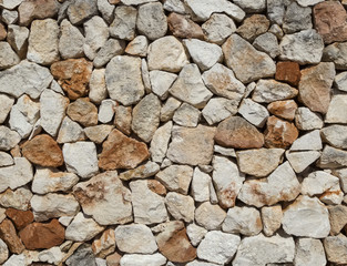 Seamless rough medieval  stone wall background.