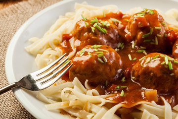 Pasta fettuccine and meatballs with tomato sauce