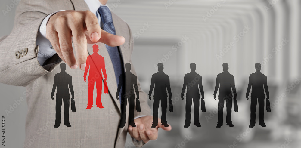 Wall mural businessman hand choosing people icon as human resources concept