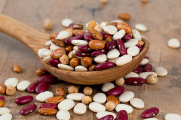 various beans on wooden surface