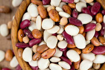 various beans on wooden surface