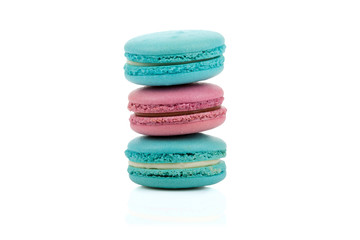 Fototapeta na wymiar Three delicious red and green colored macaroons isolated