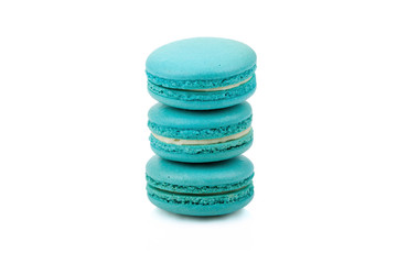 Three green colored macaroons isolated