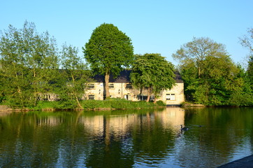 Fototapeta na wymiar A house by the River Wye at Bakewell in England