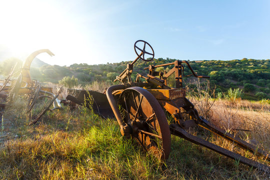Antique Farm Equipment at sunrise, Italy