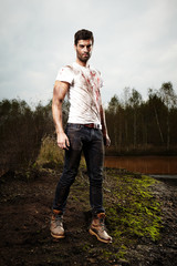 Man fighter after combat in bloody shirt