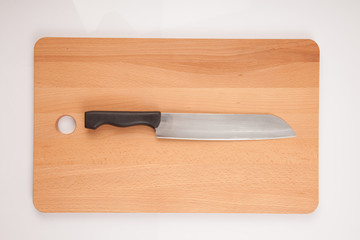Knife and  wooden chopping board