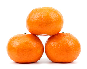 Three isolated tangerine on white background