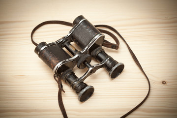 Old binoculars since the Great Patriotic War on the wooden table