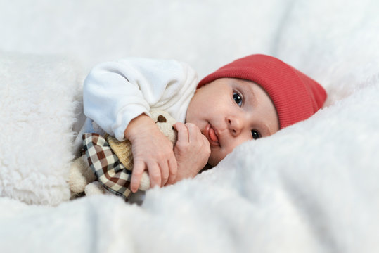  Baby In Red Hat Shows Tongue