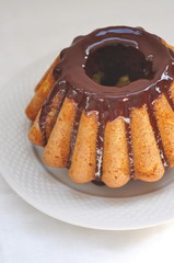 Cake with chocolate icing, selective focus