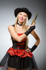 Woman pirate with gun wearing hat