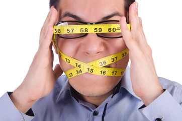 Man with centimeter in dieting concept