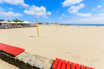 Obraz premium Sandy beach in port of Gdynia in summer, Baltic Sea, Poland