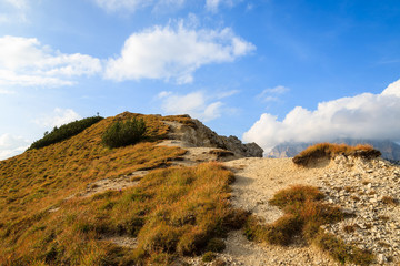 Alpine trail in autumn season, Dolomites Mountains, Italy