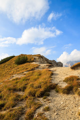 Alpine trail in autumn season, Dolomites Mountains, Italy