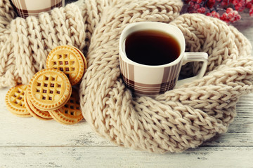 Cups of tea with cookies on table close-up