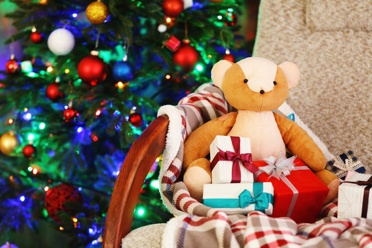 Christmas tree with teddy bear and gift boxes