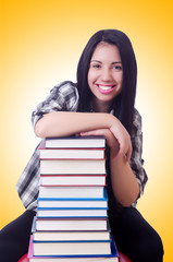 Girl student with books on white