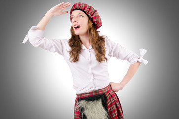 Young woman in traditional scottish clothing