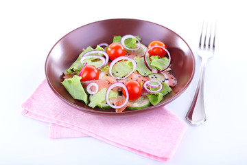 Appetizing fish salad with vegetables on plate isolated on