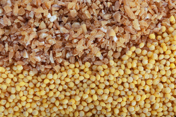 Fototapeta premium Healthy whole grain bulgur and millet grains texture background, nutrient-rich food ingredients for balanced diet