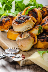 Pizza snails, minipizza with salad and parmagio