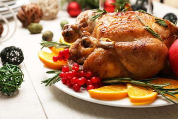 Baked chicken for festive dinner. Christmas table setting