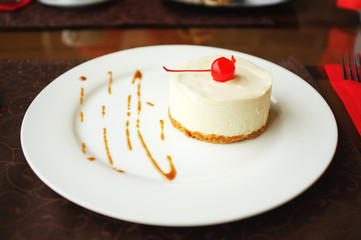 Tasty cake on plate in cafe