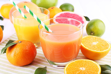Juices and many citrus close-up