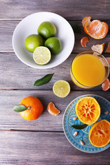 Juice and citrus on table close-up