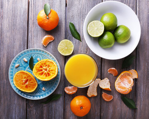 Juice and citrus on table close-up