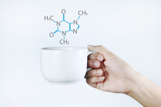 Woman holding a coffee cup.