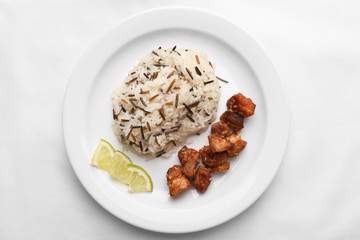 Tasty rice with meat served on table, close-up